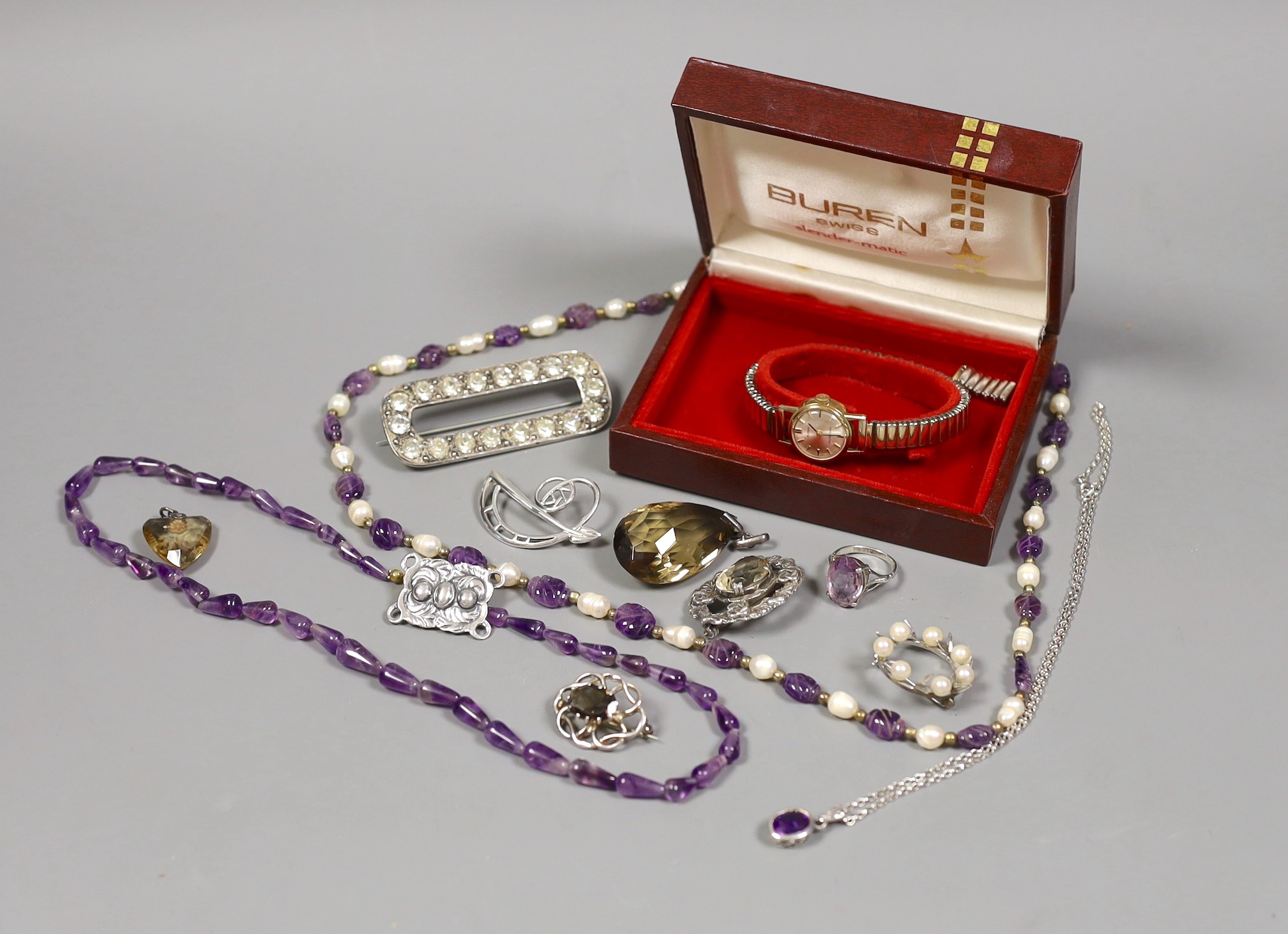 A late Victorian silver and paste set oval brooch, a lady's 9ct gold Buren manual wind wrist watch, an amethyst and freshwater? pearl necklace and other jewellery including amethyst ring and citrine set pendant.
